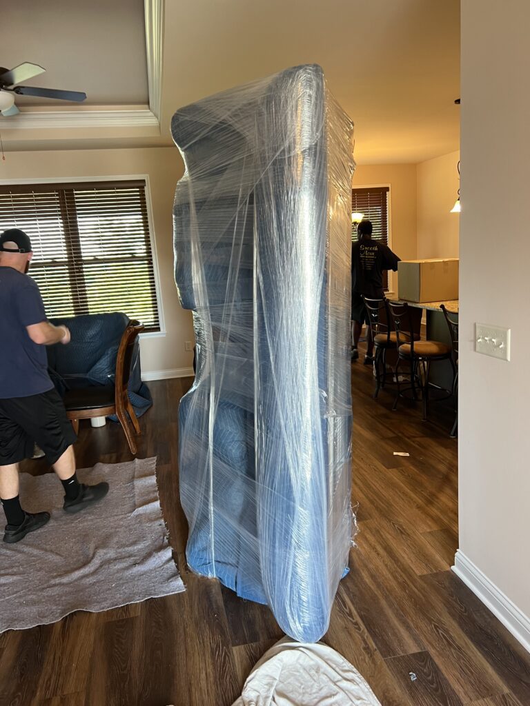 A Sofa Wrapped With Plastic